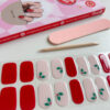 Gellak Stickers Holly Jolly kerst gel nagels, rood en roze met stipjes en een kersthuls nailart